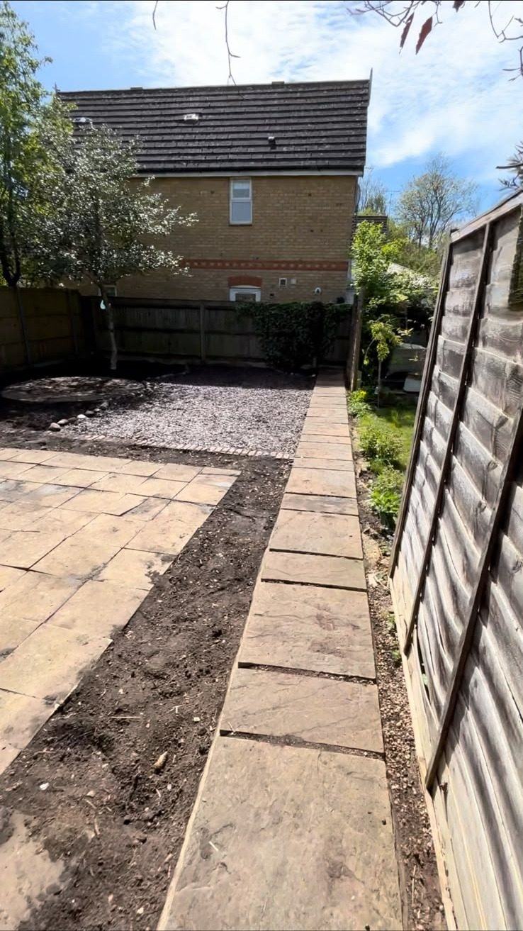 Bare ground either side of a new path