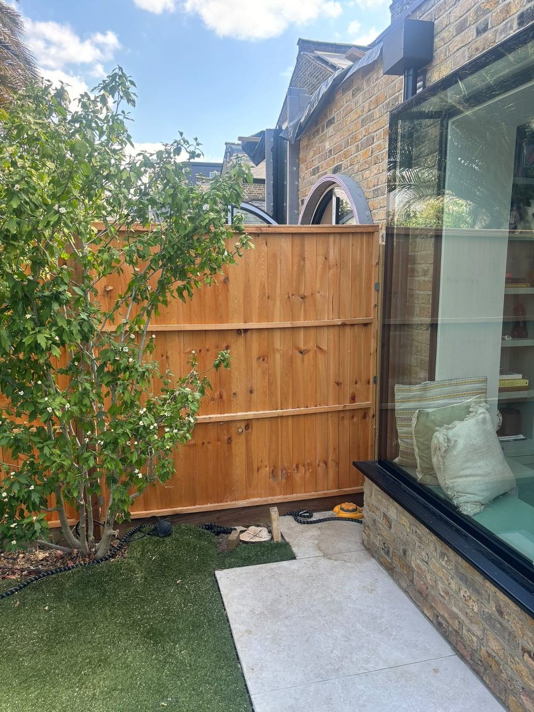 New lawn beside a fresh fence