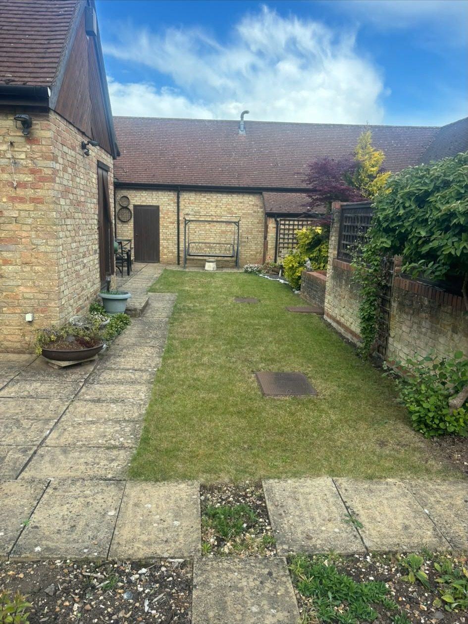 Lawn and paving in a narrow garden